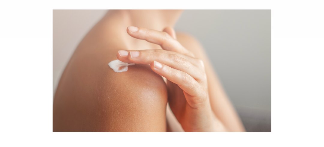 Applying moisturizing cream to the shoulder